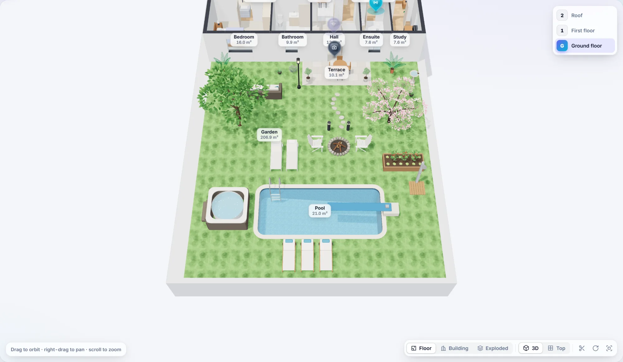 A swimming pool sunk into a garden, with a ladder, diving board, hot tub and loungers